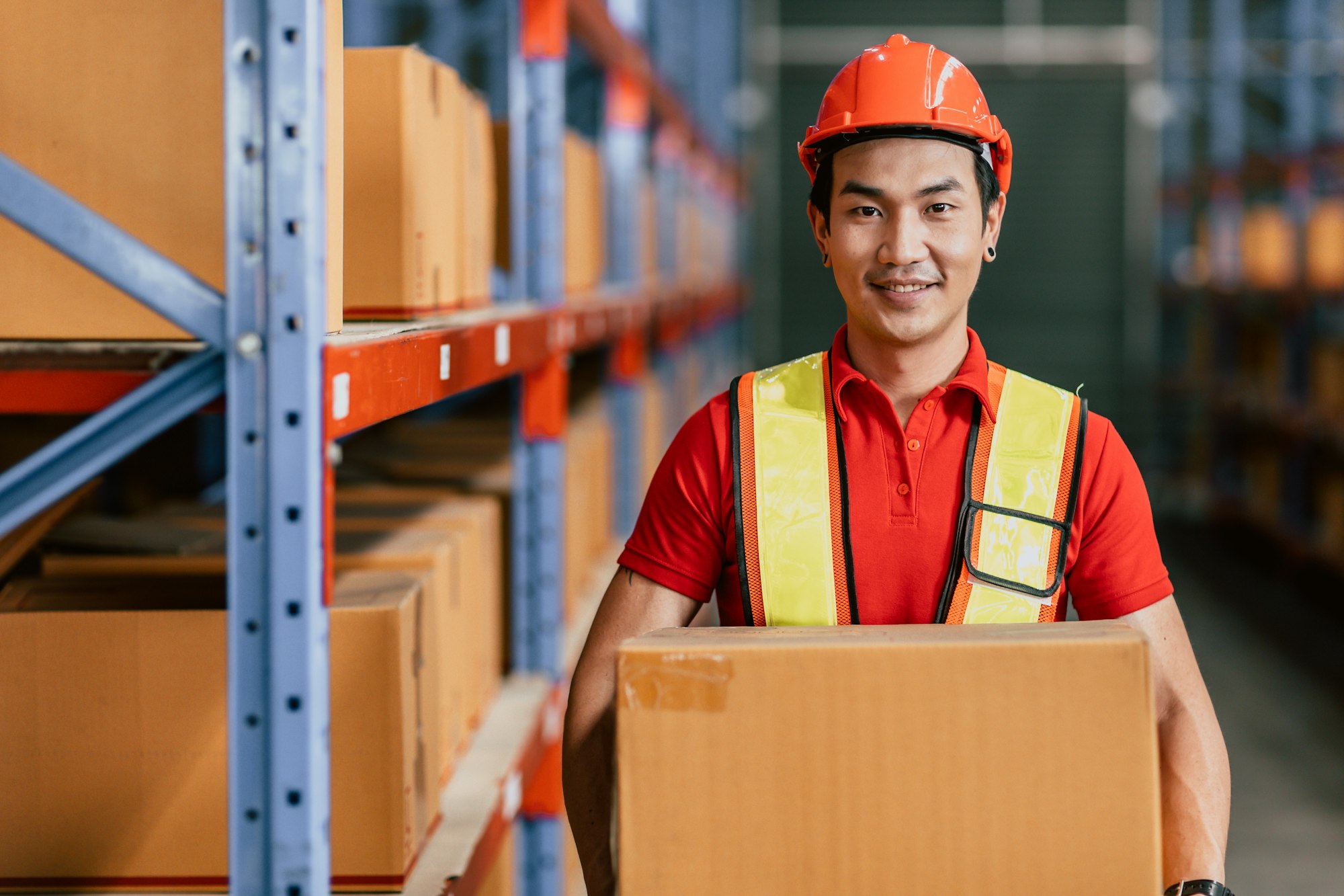 Warehouse staff worker at cargo inventory handle goods products box portrait happy smiling